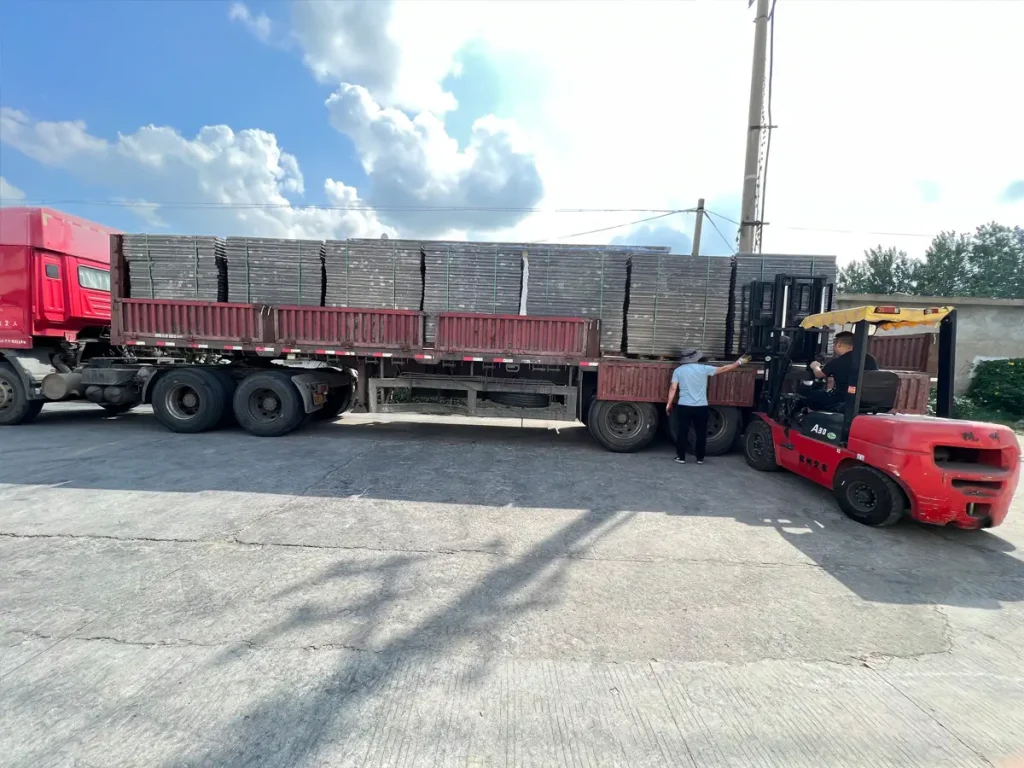Batch metal parts loaded on a truck for OEM delivery